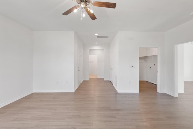 spare room with ceiling fan and light hardwood / wood-style floors