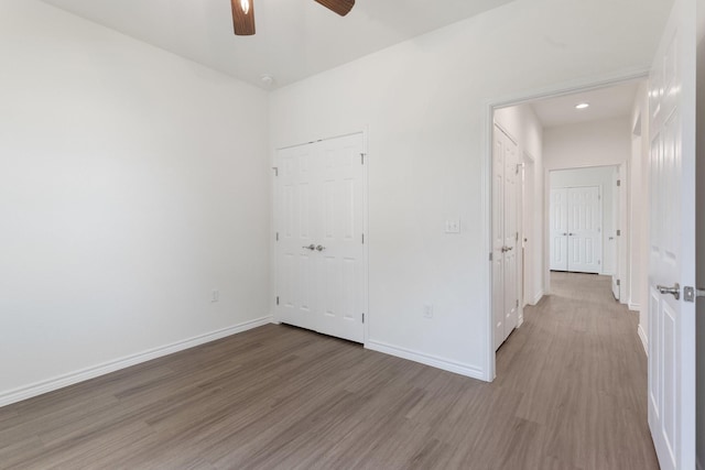 empty room featuring light hardwood / wood-style floors and ceiling fan