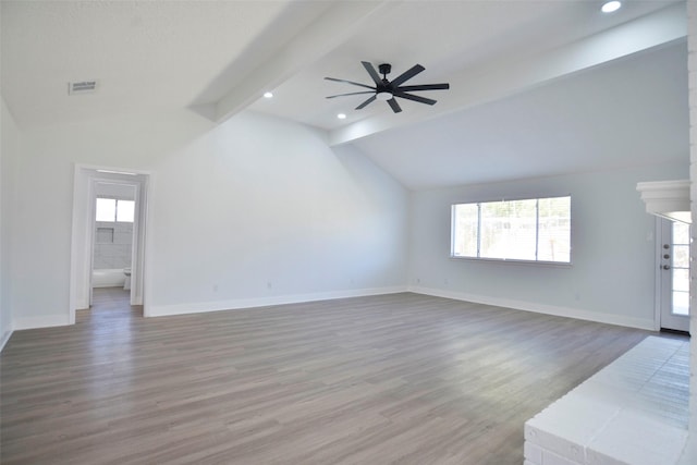 unfurnished living room featuring lofted ceiling with beams, hardwood / wood-style flooring, and ceiling fan