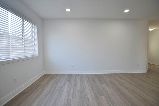 unfurnished room featuring light wood-type flooring