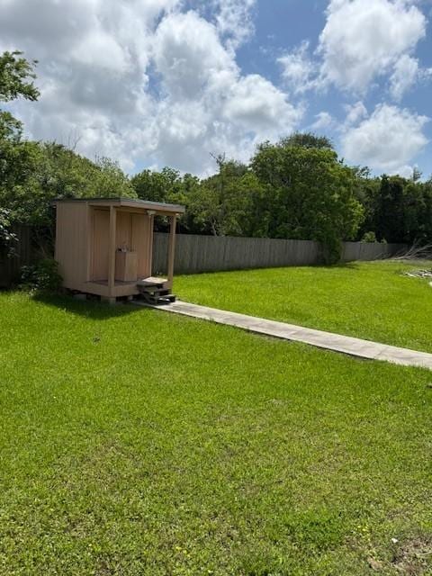 7 N Pine Rd, Texas City, TX 77591 - view of yard featuring a storage unit and an outdoor structure