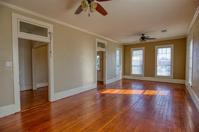 spare room with dark hardwood / wood-style flooring, crown molding, and ceiling fan