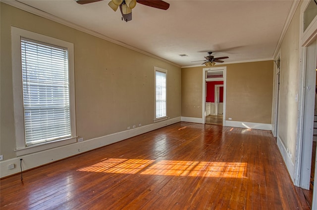 spare room with crown molding, ceiling fan, and hardwood / wood-style flooring