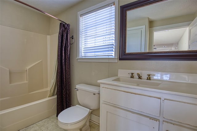 full bathroom with vanity, shower / tub combo, and toilet