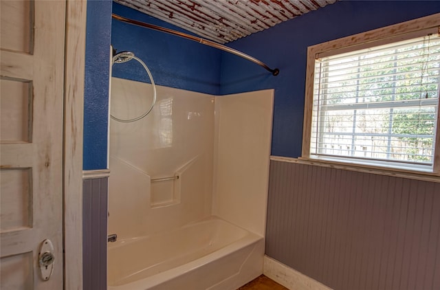 bathroom featuring washtub / shower combination