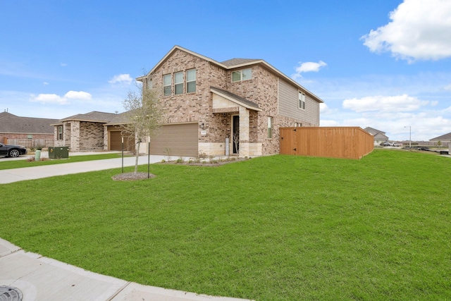 view of front of property with a garage and a front lawn