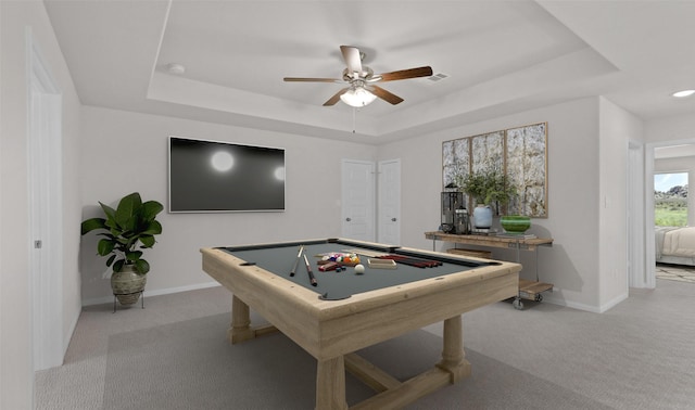 game room with light carpet, billiards, a raised ceiling, and ceiling fan