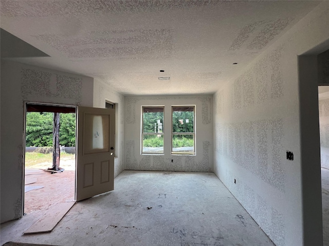 290 Peninsula Point Dr, Montgomery, TX 77356 - empty room featuring a textured ceiling