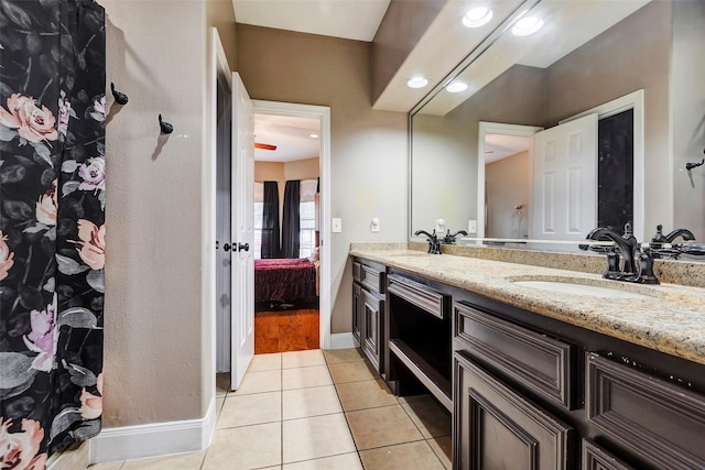 bathroom featuring tile patterned flooring and vanity