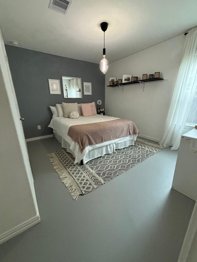 bedroom with concrete floors