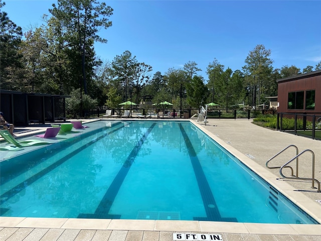 view of swimming pool featuring a patio area