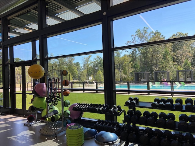 exercise room with expansive windows and a wealth of natural light