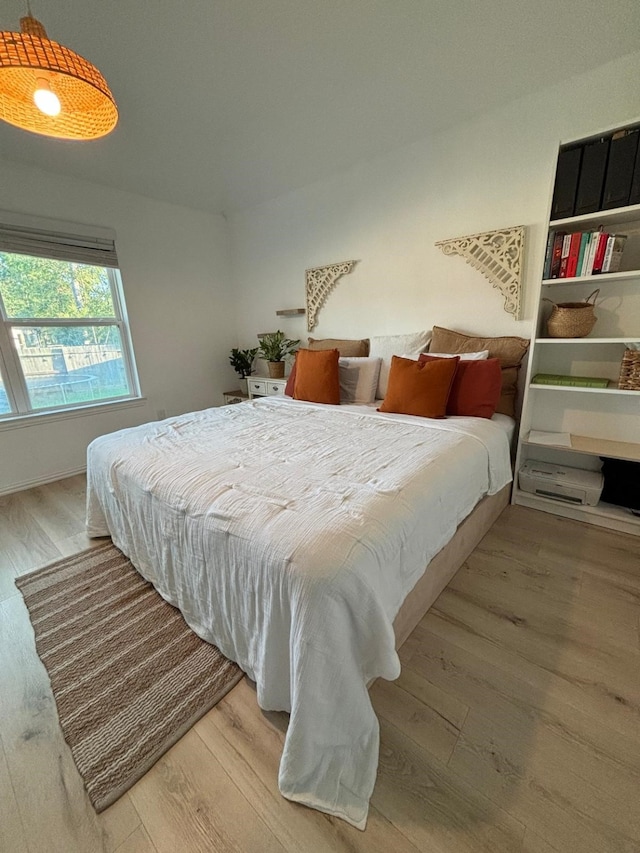 bedroom with light wood-type flooring