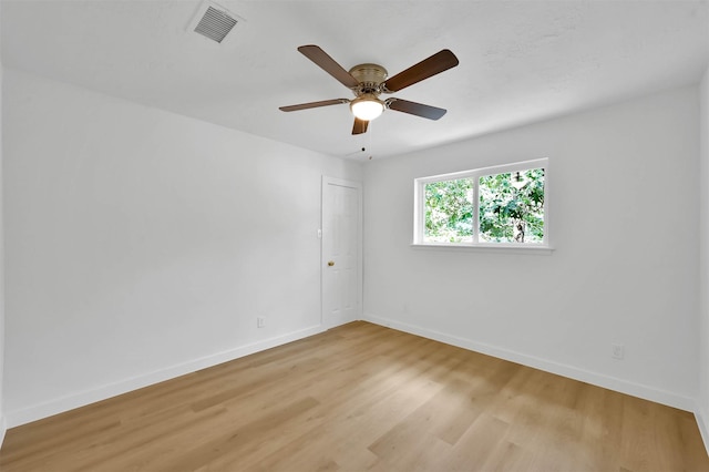 empty room featuring ceiling fan and light wood-type flooring