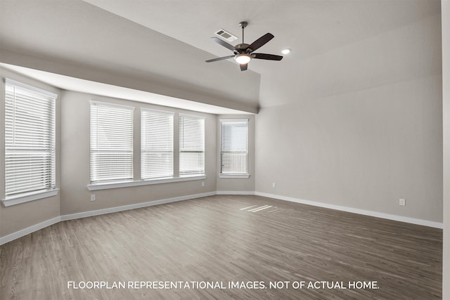 unfurnished room featuring ceiling fan, wood finished floors, visible vents, and baseboards