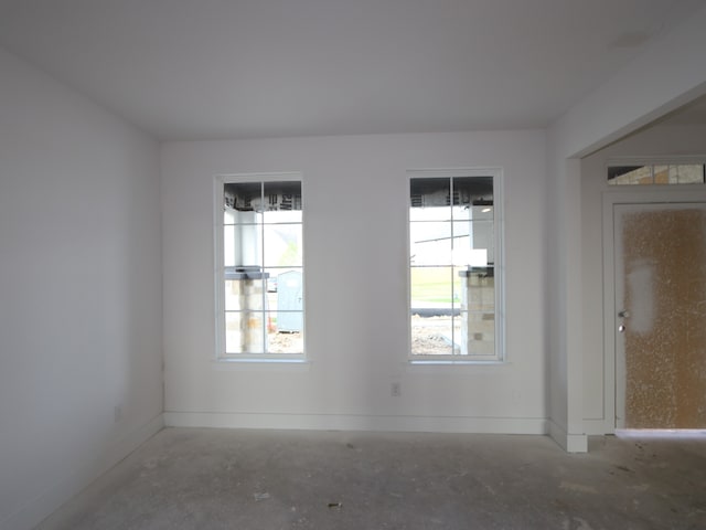 8315 Oceanmist Cove Dr, Cypress, TX 77433 - spare room with baseboards and concrete flooring