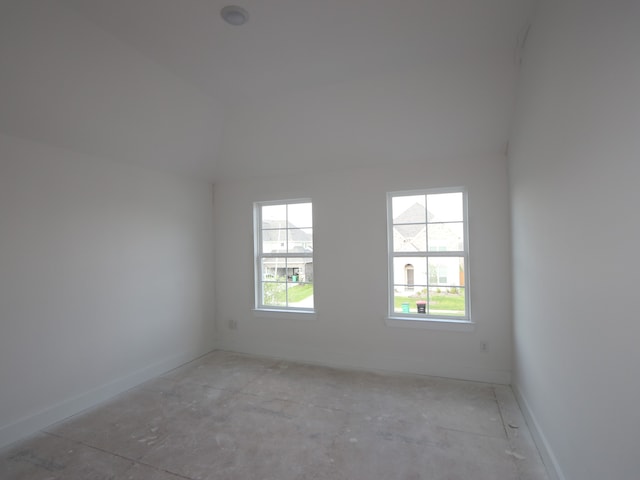 8315 Oceanmist Cove Dr, Cypress, TX 77433 - empty room featuring vaulted ceiling and baseboards