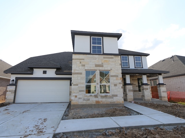 8315 Oceanmist Cove Dr, Cypress, TX 77433 - modern home featuring stone siding, driveway, a garage, and roof with shingles