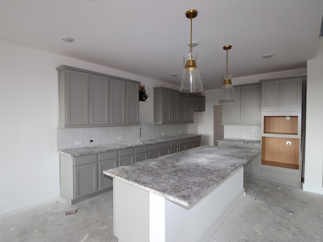 8315 Oceanmist Cove Dr, Cypress, TX 77433 - kitchen with gray cabinets and unfinished concrete floors