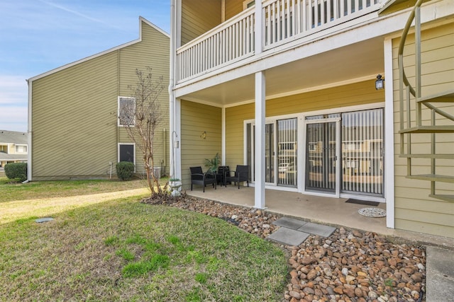 exterior space featuring a lawn and a patio