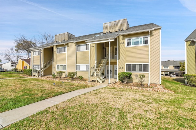 view of property with central AC and stairway