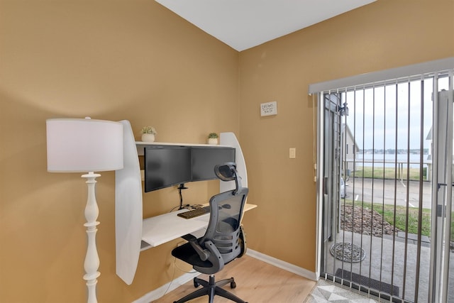 office with baseboards and wood finished floors