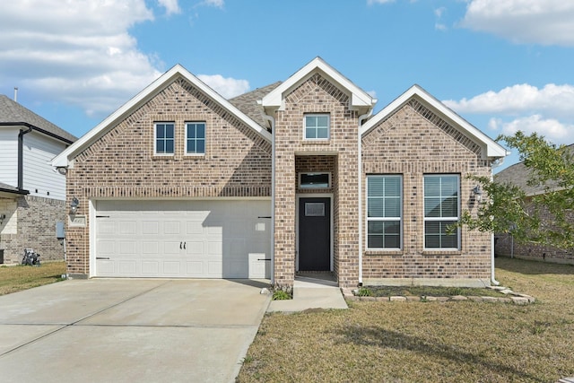 view of front of property featuring a garage and a front lawn