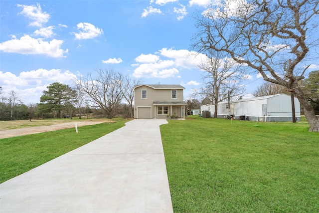 view of front of home featuring a garage and a front yard