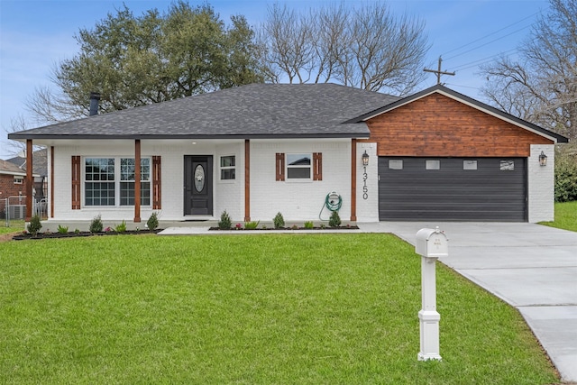 ranch-style house featuring a garage and a front yard