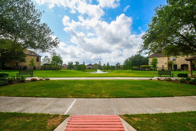 surrounding community featuring a yard