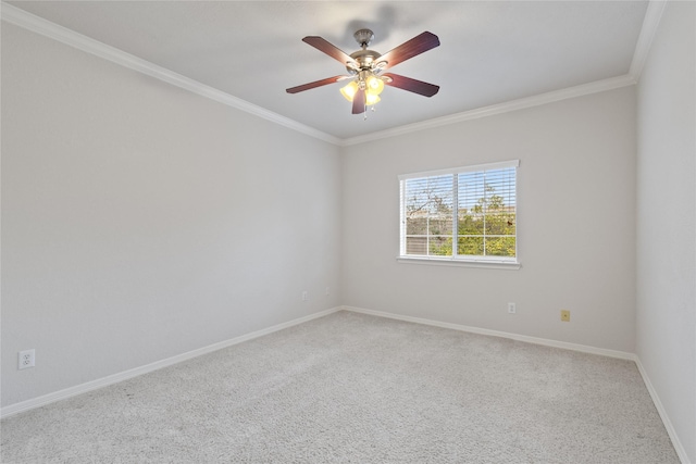 carpeted empty room with crown molding and ceiling fan