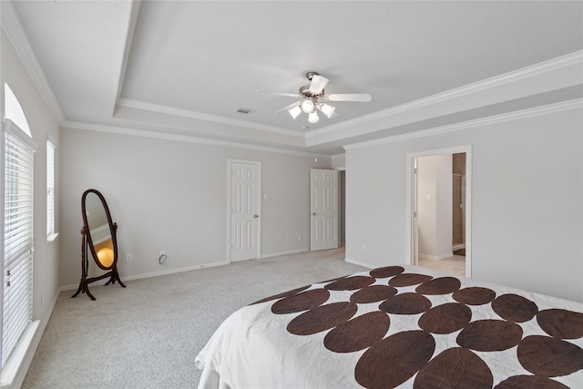 bedroom featuring visible vents, baseboards, ornamental molding, light carpet, and a raised ceiling