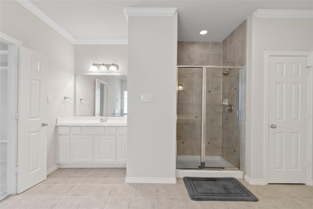 full bathroom featuring tile patterned flooring, a shower stall, vanity, and ornamental molding