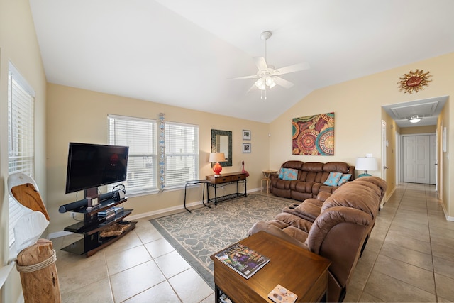 living area featuring baseboards, attic access, lofted ceiling, ceiling fan, and tile patterned floors