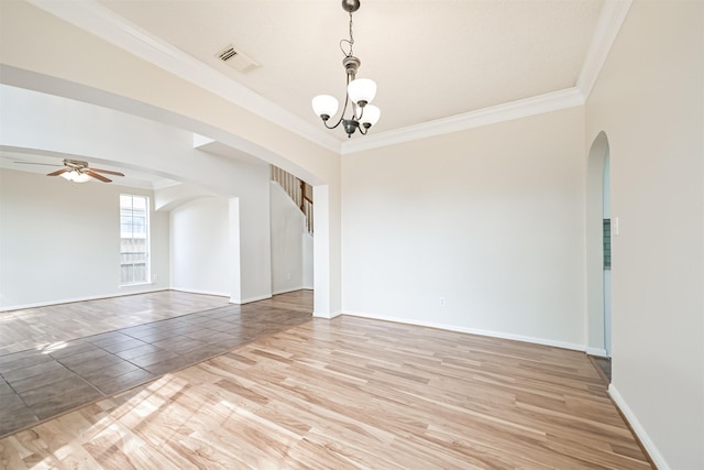 empty room with crown molding, ceiling fan with notable chandelier, and hardwood / wood-style floors