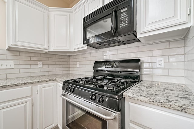 kitchen featuring white cabinetry, backsplash, stainless steel range with gas cooktop, and light stone countertops