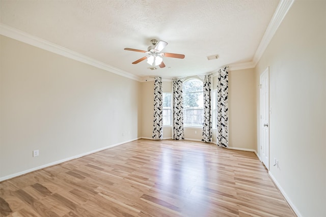 empty room with crown molding, ceiling fan, light hardwood / wood-style floors, and a textured ceiling