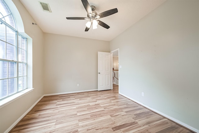 unfurnished room with ceiling fan and light hardwood / wood-style flooring