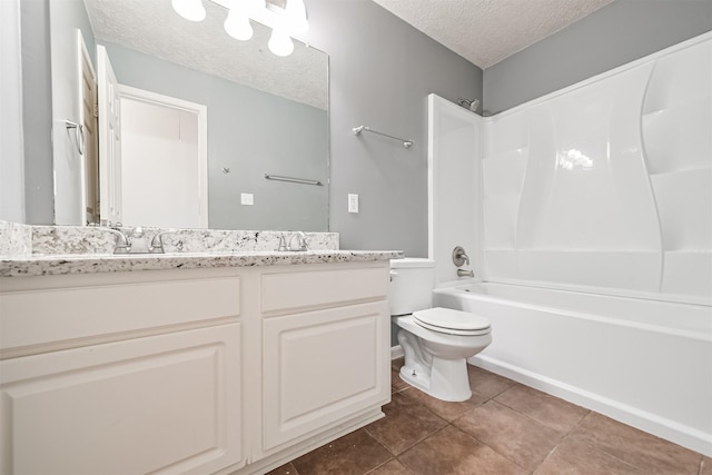 full bathroom with tile patterned flooring, vanity, a textured ceiling, shower / bathtub combination, and toilet