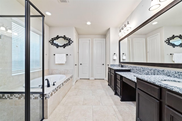 bathroom with a shower stall, recessed lighting, vanity, and a garden tub
