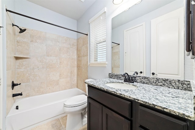 bathroom featuring toilet, shower / bath combination, and vanity