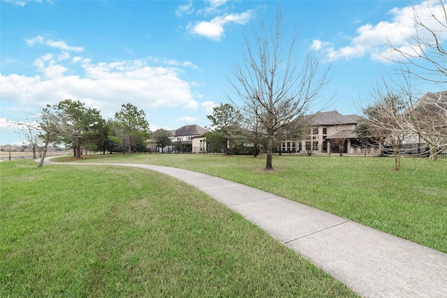 view of home's community featuring a lawn