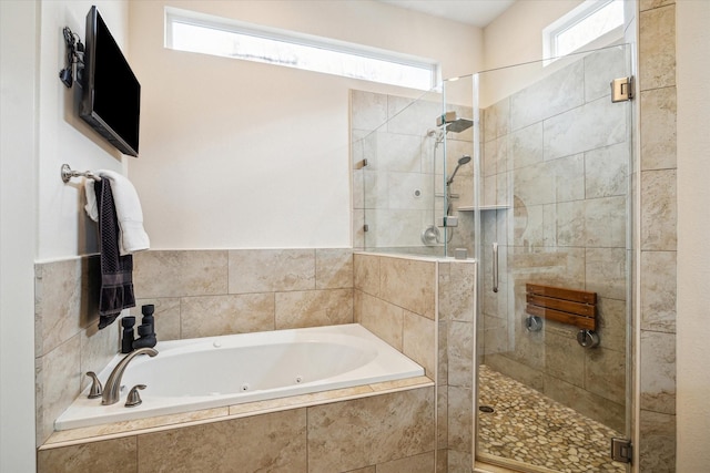 bathroom featuring plus walk in shower