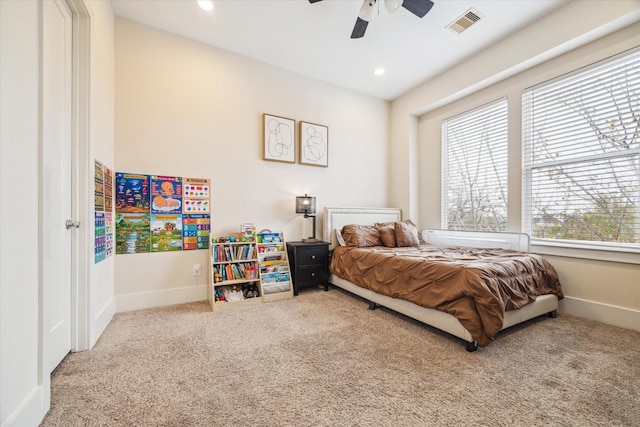 bedroom featuring ceiling fan and carpet