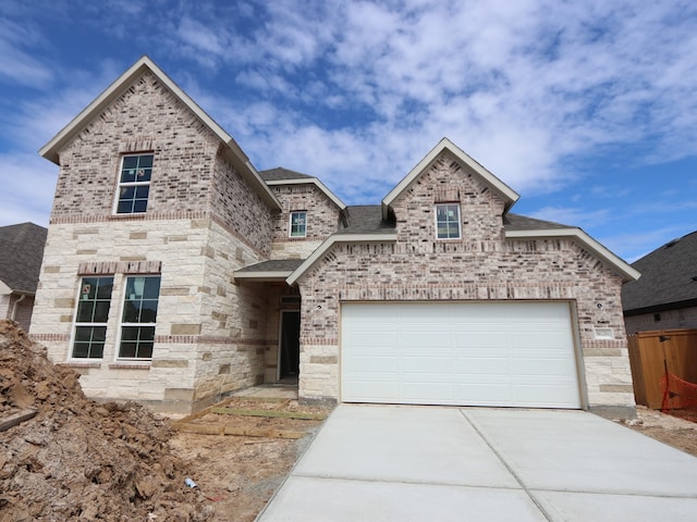 8626 Sun Coral Dr, Cypress, TX 77433 - french country home with driveway and brick siding