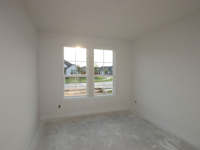 8626 Sun Coral Dr, Cypress, TX 77433 - unfurnished room featuring unfinished concrete flooring and baseboards