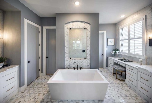 full bathroom featuring a shower stall, recessed lighting, and a freestanding bath