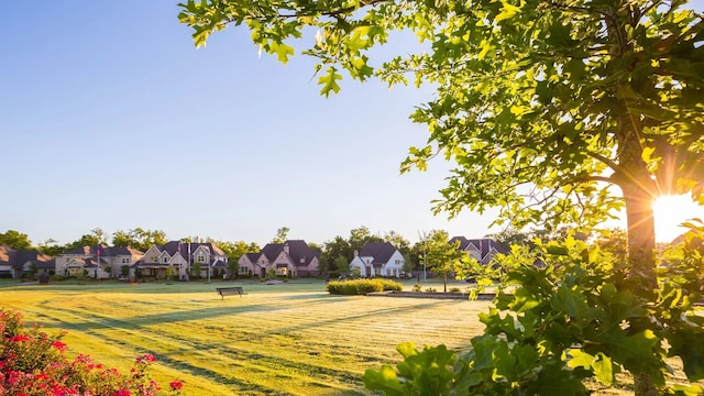 view of home's community with a lawn