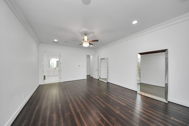 unfurnished living room with dark wood-style floors, recessed lighting, crown molding, and baseboards