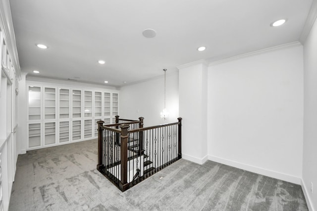 interior space featuring light carpet, recessed lighting, baseboards, and ornamental molding